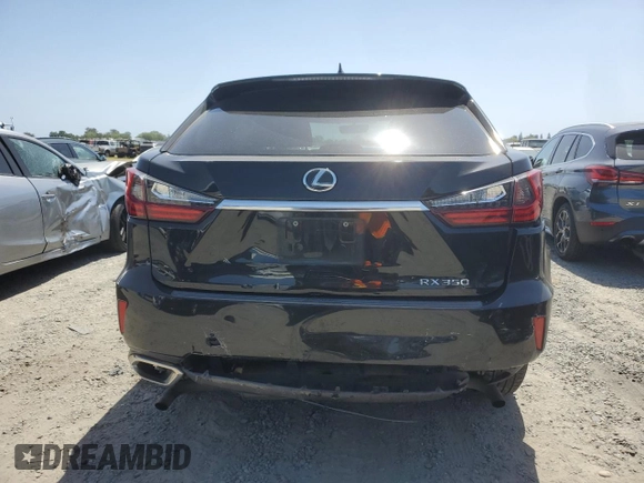 2016 Lexus RX 350 with VIN 2T2BZMCA3GC051837, listed as a Copart auction lot 54097075 with 239,956 mi miles and Salvage Title. Bid and sale history available at DreamBid. Image 6.
