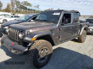 2023 Jeep Gladiator Rubicon with VIN 1C6JJTBGXPL574702, listed as a Copart auction lot 75914474 with 10,506 mi miles and Salvage title. Bid and sale history available at DreamBid. Image 1.