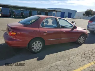 2000 Hyundai Elantra GLS z VIN KMHJF35F9YU919481, wystawiony jako Copart lot #79717924 z przebiegiem 137 918 mil mil oraz Szkoda całkowita • Salvage title. Historia ofert i sprzedaży dostępna na DreamBid. Obrazek 3.