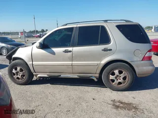 2003 Mercedes-Benz M-Class 3.7L with VIN 4JGAB57E23A453057, listed as a IAAI auction lot 41704721 with 190,649 mi miles. Bid and sale history available at carsss.com. Image 14.