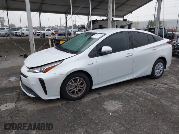 2021 Toyota Prius L Eco with VIN JTDKAMFU6M3150707, listed as a IAAI auction lot 41867272 with 55,499 mi miles and . Bid and sale history available at DreamBid. Image 2.