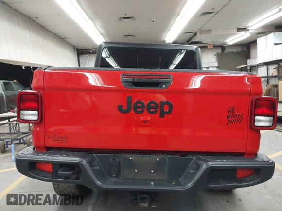 2022 Jeep Gladiator Altitude z VIN 1C6HJTAGXNL117353, wystawiony jako IAAI lot #42427921 z przebiegiem 28 801 mil mil oraz . Historia ofert i sprzedaży dostępna na DreamBid. Obrazek 16.