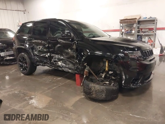2017 Jeep Grand Cherokee SRT with VIN 1C4RJFDJ9HC739324, listed as a IAAI auction lot 40898998 with 92,547 mi miles. Bid and sale history available at carsss.com. Image 1.