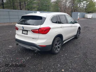 2018 BMW X1 xDrive28i with VIN WBXHT3C36J5L32162, listed as a IAAI auction lot 41802315 with 80,422 mi miles. Bid and sale history available at carsss.com. Image 4.