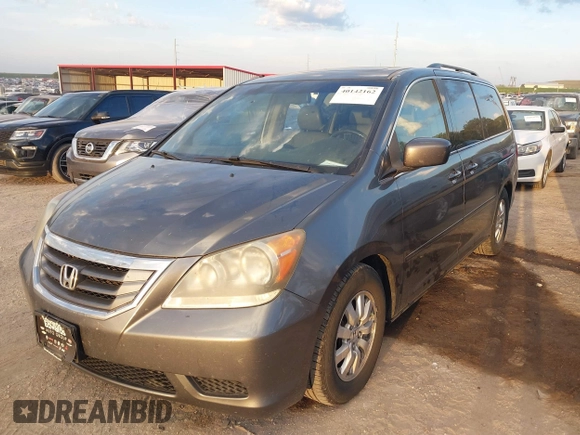 2010 Honda Odyssey EX-L with VIN 5FNRL3H70AB074913, listed as a IAAI auction lot 40142162 with 210,771 mi miles and . Bid and sale history available at DreamBid. Image 2.