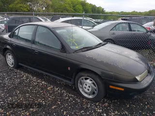 1997 Saturn SL z VIN 1G8ZJ5276VZ169416, wystawiony jako IAAI lot #42255361 z przebiegiem 143 850 mil mil oraz . Historia ofert i sprzedaży dostępna na DreamBid. Obrazek 1.