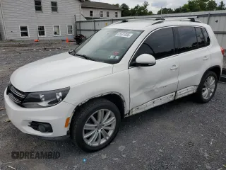 2014 Volkswagen Tiguan SEL with VIN WVGBV3AX7EW548617, listed as a Copart auction lot 65501835 with 121,390 mi miles and Salvage title. Bid and sale history available at DreamBid. Image 1.