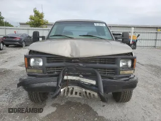 1999 Chevrolet Silverado 3500 z VIN 1GCHK33R4XF096473, wystawiony jako Copart lot #65189104 z przebiegiem 174 416 mil mil oraz Szkody całkowita. Historia ofert i sprzedaży dostępna na DreamBid. Obrazek 5.