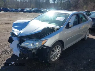 2014 Toyota Camry SE with VIN 4T1BK1FK6EU548176, listed as a IAAI auction lot 41392975 with 143,249 mi miles. Bid and sale history available at carsss.com. Image 2.