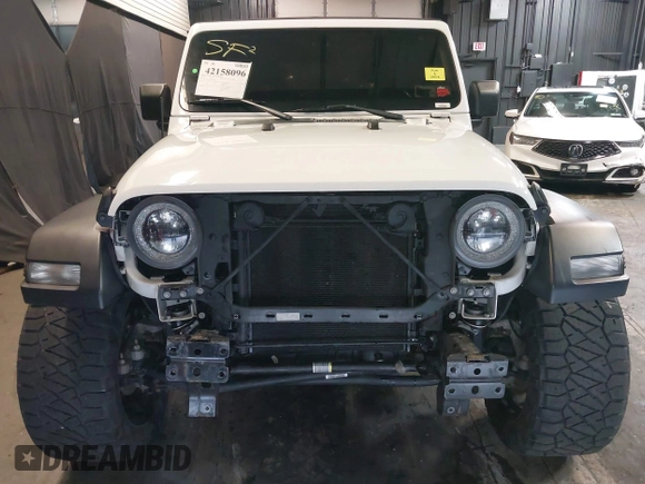2019 Jeep Wrangler Unlimited Sport S z VIN 1C4HJXDG4KW639403, wystawiony jako IAAI lot #42158096 z przebiegiem 132 569 mil mil oraz . Historia ofert i sprzedaży dostępna na DreamBid. Obrazek 13.