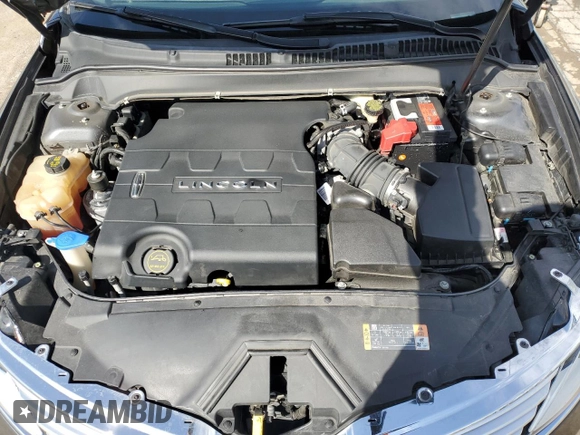 2015 Lincoln MKZ z VIN 3LN6L2JKXFR600669, wystawiony jako Copart lot #51130115 z przebiegiem 75 176 mil mil oraz Szkoda całkowita • Salvage title. Historia ofert i sprzedaży dostępna na DreamBid. Obrazek 11.