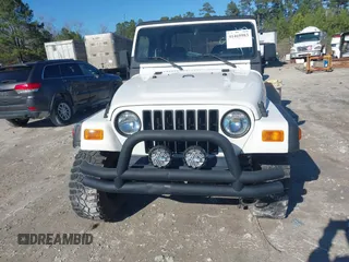 1997 Jeep Wrangler Sport with VIN 1J4FY19S7VP483735, listed as a IAAI auction lot 41469983 with 150,542 mi miles. Bid and sale history available at carsss.com. Image 12.