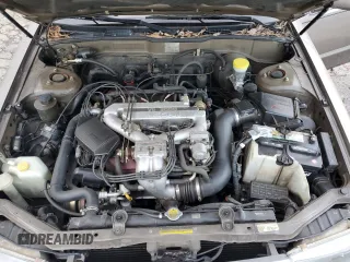 1990 Nissan Maxima z VIN JN1HJ01P3LT393901, wystawiony jako Copart lot #79912694 z przebiegiem 127 678 mil mil oraz Szkody całkowita. Historia ofert i sprzedaży dostępna na DreamBid. Obrazek 11.