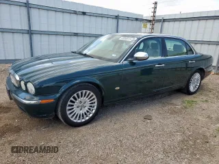 2006 Jaguar XJ Vanden Plas with VIN SAJWA82B16SH06514, listed as a Copart auction lot 60858015 with 124,132 mi miles and Salvage title. Bid and sale history available at DreamBid. Image 1.