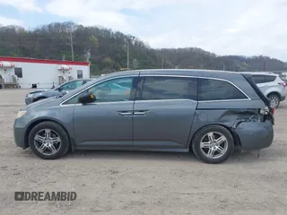 2012 Honda Odyssey Touring with VIN 5FNRL5H90CB045430, listed as a IAAI auction lot 42079770 with 113,901 mi miles and . Bid and sale history available at DreamBid. Image 15.