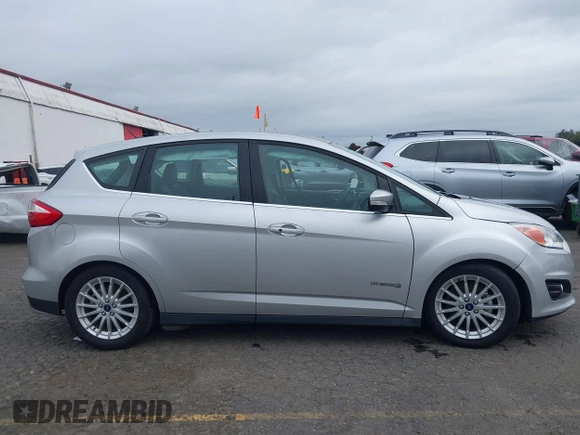 2014 Ford C-Max SEL z VIN 1FADP5BU7EL511677, wystawiony jako IAAI lot #40554962 z przebiegiem 63 031 mil mil oraz . Historia ofert i sprzedaży dostępna na DreamBid. Obrazek 12.