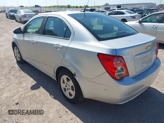 2013 Chevrolet Sonic LS with VIN 1G1JA5SH1D4246936, listed as a IAAI auction lot 42665664 with 124,464 mi miles and . Bid and sale history available at DreamBid. Image 3.