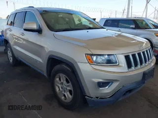 2014 Jeep Grand Cherokee Laredo with VIN 1C4RJFAG7EC380544, listed as a IAAI auction lot 42021130 with 166,589 mi miles. Bid and sale history available at carsss.com. Image 1.