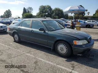 1996 Acura RL with VIN JH4KA965XTC009917, listed as a Copart auction lot 65083665 with 197,486 mi miles and Salvage title. Bid and sale history available at DreamBid. Image 4.