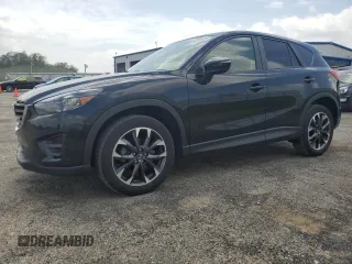 2016 Mazda CX-5 Grand Touring z VIN JM3KE4DY7G0855846, wystawiony jako Copart lot #57260535 z przebiegiem 80 546 mil mil oraz Czysty tytuł • Clean title. Historia ofert i sprzedaży dostępna na DreamBid. Obrazek 1.