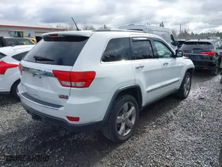 2013 Jeep Grand Cherokee Limited with VIN 1C4RJFBT0DC619216, listed as a IAAI auction lot 41703137 with 142,577 mi miles. Bid and sale history available at carsss.com. Image 4.