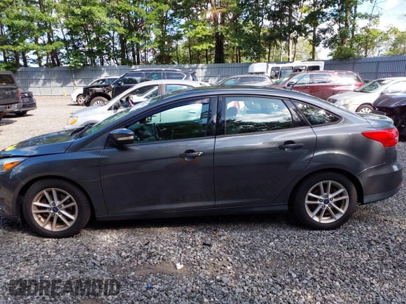 2018 Ford Focus SE z VIN 1FADP3FE0JL284107, wystawiony jako IAAI lot #42815845 z przebiegiem 110 155 mil mil oraz . Historia ofert i sprzedaży dostępna na DreamBid. Obrazek 14.