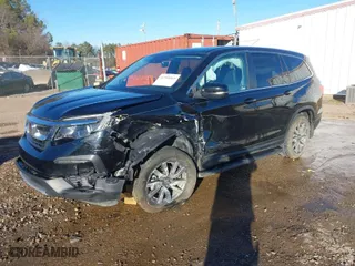2021 Honda Pilot EX-L with VIN 5FNYF5H54MB038028, listed as a IAAI auction lot 41398565 with 63,779 mi miles. Bid and sale history available at carsss.com. Image 2.