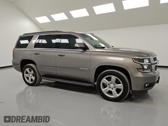 2019 Chevrolet Tahoe LT with VIN 1GNSCBKC0KR100687, listed as a Copart auction lot 53123455 with 104,006 mi miles and Clean title. Bid and sale history available at DreamBid. Image 4.