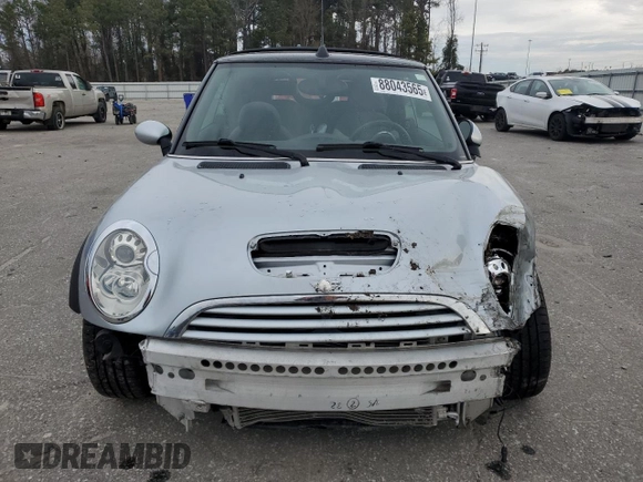 2005 MINI Convertible S with VIN WMWRH33575TK56034, listed as a Copart auction lot 88043565 with 33,410 mi miles and Salvage title. Bid and sale history available at DreamBid. Image 5.