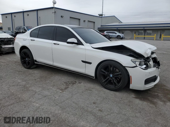 2013 BMW 7 Series 740i with VIN WBAYA6C55DC995290, listed as a Copart auction lot 82022284 with 128,882 mi miles and Salvage Title. Bid and sale history available at carsss.com. Image 4.