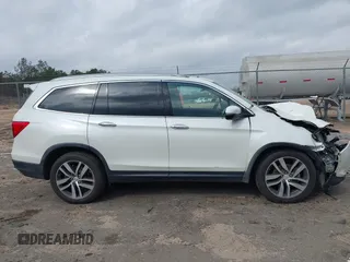 2017 Honda Pilot Elite with VIN 5FNYF6H04HB042192, listed as a IAAI auction lot 41780875 with 158,491 mi miles and . Bid and sale history available at DreamBid. Image 13.