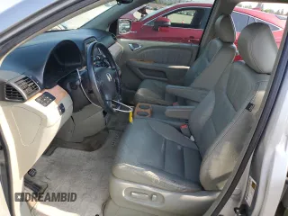 2006 Honda Odyssey EX-L z VIN 5FNRL38756B087695, wystawiony jako Copart lot #60122525 z przebiegiem 213 221 mil mil oraz Szkoda całkowita • Salvage title. Historia ofert i sprzedaży dostępna na DreamBid. Obrazek 7.