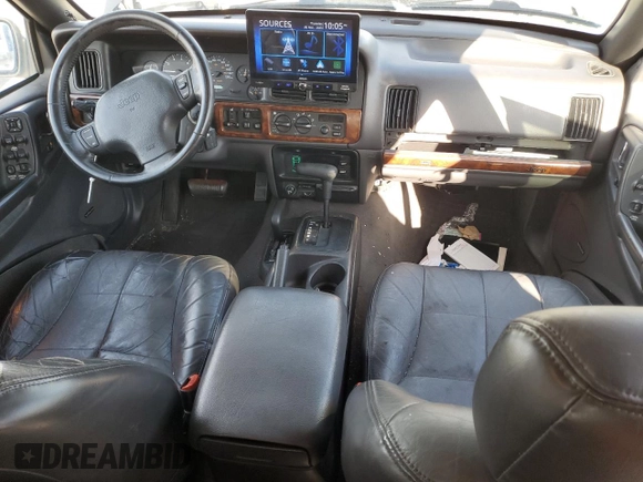 1997 Jeep Grand Cherokee Limited with VIN 1J4GZ78Y4VC754624, listed as a Copart auction lot 49884435 with 144,682 mi miles and Salvage Title. Bid and sale history available at carsss.com. Image 8.
