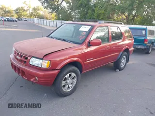 2001 Isuzu Rodeo S z VIN 4S2CK58W414308980, wystawiony jako IAAI lot #42496432 z przebiegiem 166 360 mil mil oraz . Historia ofert i sprzedaży dostępna na DreamBid. Obrazek 2.