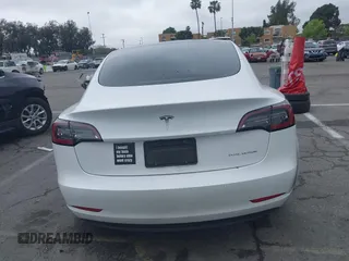 2021 Tesla Model 3 Long Range with VIN 5YJ3E1EB6MF878957, listed as a IAAI auction lot 41915482 with 59,578 mi miles. Bid and sale history available at carsss.com. Image 16.