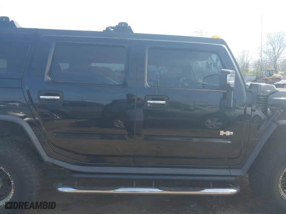2005 Hummer H2 SUV with VIN 5GRGN23U05H128420, listed as a IAAI auction lot 41983395 with 194,925 mi miles. Bid and sale history available at carsss.com. Image 14.
