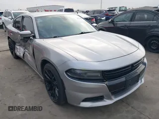 2015 Dodge Charger SXT with VIN 2C3CDXHG4FH884058, listed as a IAAI auction lot 41724894 with 202,701 mi miles and . Bid and sale history available at DreamBid. Image 1.