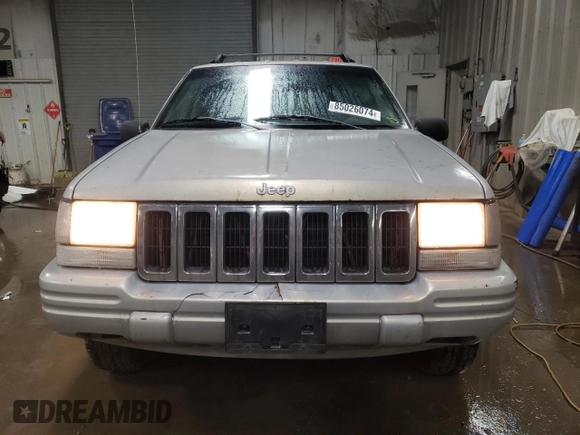 1998 Jeep Grand Cherokee Laredo with VIN 1J4GZ48S3WC269693, listed as a Copart auction lot 85026074 with 308,791 mi miles and Salvage Title. Bid and sale history available at carsss.com. Image 5.