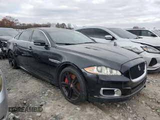 2014 Jaguar XJ with VIN SAJWA2EKXEMV64494, listed as a Copart auction lot 82634004 with 119,811 mi miles and Clean title. Bid and sale history available at DreamBid. Image 4.