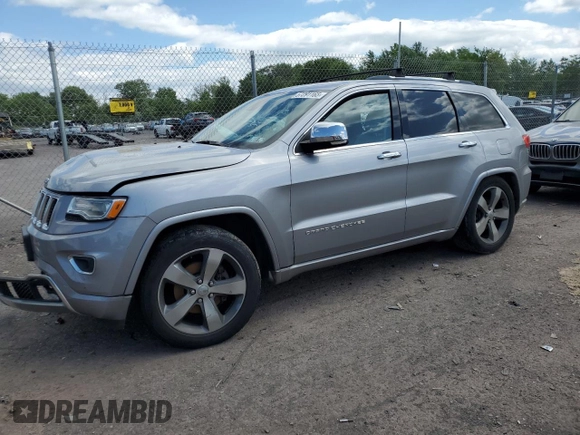 2015 Jeep Grand Cherokee Overland with VIN 1C4RJFCG3FC880084, listed as a Copart auction lot 57291165 with 112,442 mi miles and Salvage title. Bid and sale history available at DreamBid. Image 1.