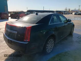 2013 Cadillac CTS Performance with VIN 1G6DK5E33D0111422, listed as a Copart auction lot 50121745 with 129,335 mi miles and Salvage Title. Bid and sale history available at DreamBid. Image 3.
