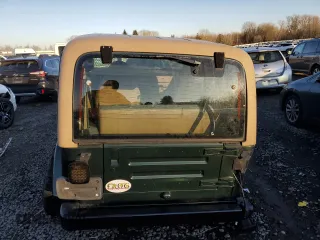 1998 Jeep Wrangler Sahara z VIN 1J4FY49S5WP798505, wystawiony jako Copart lot #88394465 z przebiegiem Nie podano mil oraz Szkoda całkowita • Salvage title. Historia ofert i sprzedaży dostępna na DreamBid. Obrazek 6.