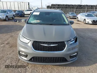 2021 Chrysler Pacifica Touring L with VIN 2C4RC1BG4MR598328, listed as a IAAI auction lot 41749306 with 78,035 mi miles and . Bid and sale history available at DreamBid. Image 12.