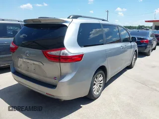 2015 Toyota Sienna XLE with VIN 5TDYK3DC0FS555636, listed as a IAAI auction lot 42099577 with 114,975 mi miles. Bid and sale history available at carsss.com. Image 4.