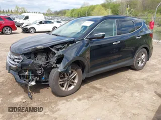 2018 Hyundai Santa Fe 2.4L z VIN 5NMZUDLB2JH058032, wystawiony jako IAAI lot #42206116 z przebiegiem 138 688 mil mil oraz . Historia ofert i sprzedaży dostępna na DreamBid. Obrazek 2.