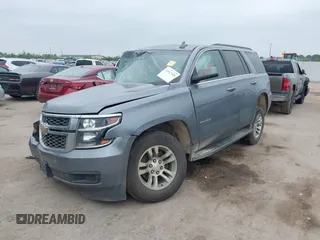 2020 Chevrolet Tahoe LS z VIN 1GNSCAKC3LR101733, wystawiony jako IAAI lot #41912918 z przebiegiem 153 731 mil mil oraz . Historia ofert i sprzedaży dostępna na DreamBid. Obrazek 2.