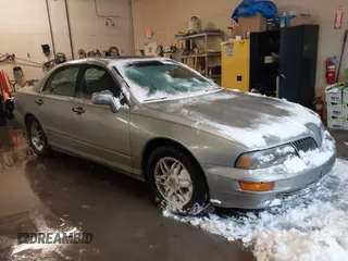 2002 Mitsubishi Diamante LS z VIN 6MMAP67P32T005867, wystawiony jako IAAI lot #41586460 z przebiegiem 390 586 mil mil oraz . Historia ofert i sprzedaży dostępna na DreamBid. Obrazek 1.