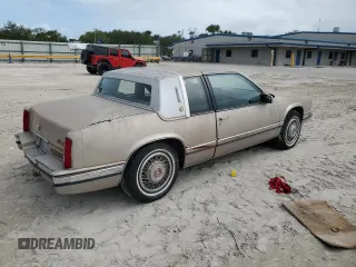 1991 Cadillac Eldorado z VIN 1G6EL13B4MU604636, wystawiony jako Copart lot #79155234 z przebiegiem Nie podano mil oraz Nie do naprawy. Historia ofert i sprzedaży dostępna na DreamBid. Obrazek 3.