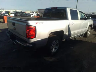 2015 Chevrolet Silverado 1500 LT with VIN 3GCUKREC7FG138643, listed as a IAAI auction lot 41582933 with 112,771 mi miles. Bid and sale history available at carsss.com. Image 4.