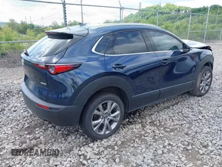 2021 Mazda CX-30 Premium z VIN 3MVDMBDL7MM236474, wystawiony jako IAAI lot #42284515 z przebiegiem 58 565 mil mil oraz . Historia ofert i sprzedaży dostępna na DreamBid. Obrazek 4.